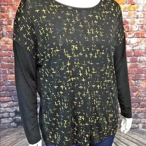 Black top with gold zipper and gold cross print